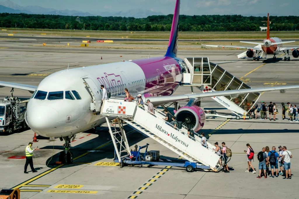 Passengers boarding an aeroplane in preparation for flying.