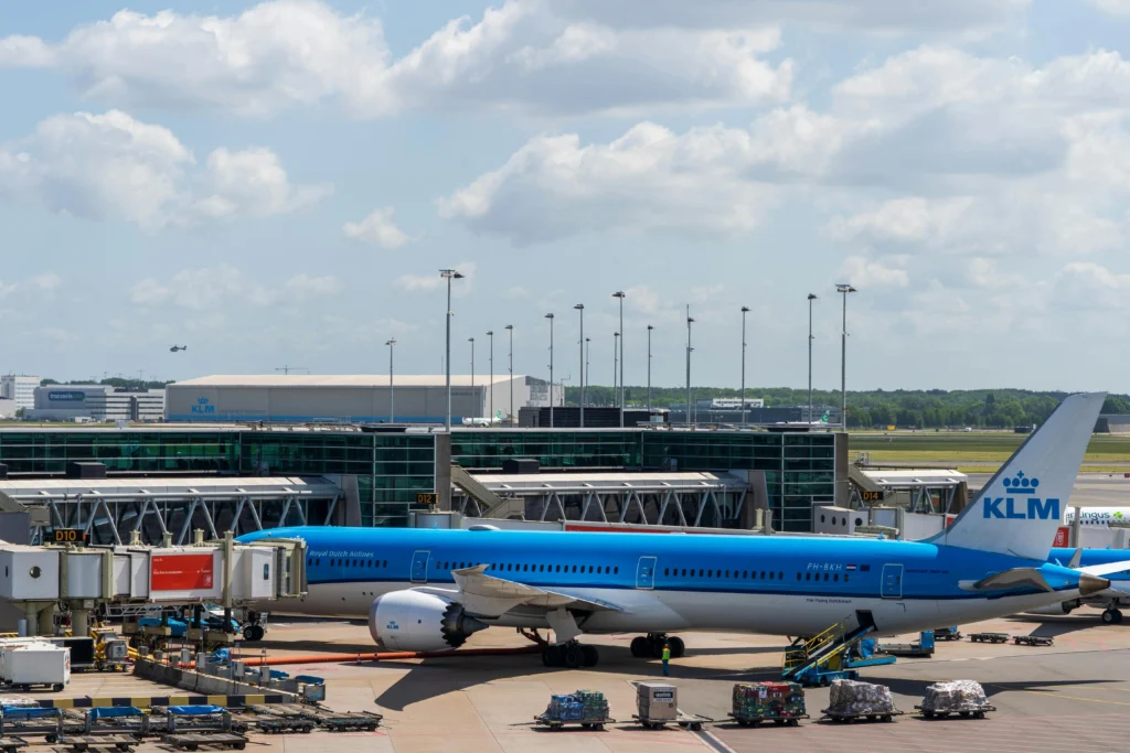  Schiphol Airport in Amsterdam with KLM plane on the tarmac. Good destination for your vegan travel.