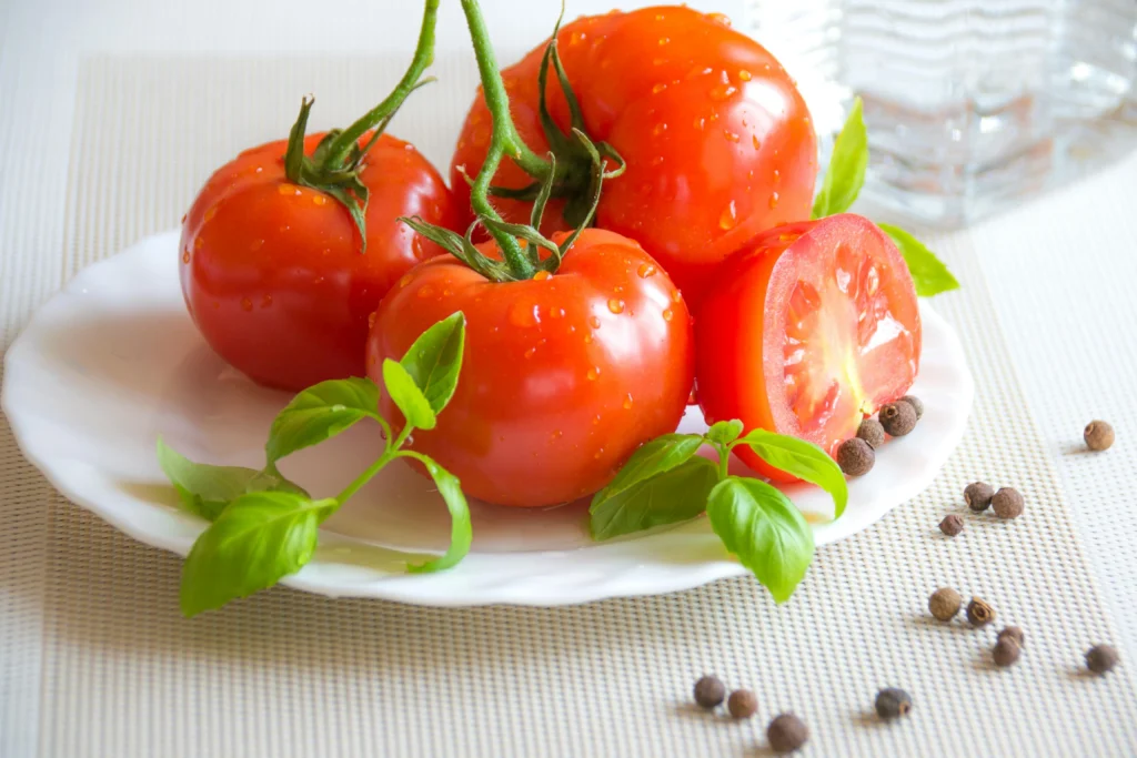 Tomatoes on a ceramic plate, perfect for plant-based lifestyle in South Africa.